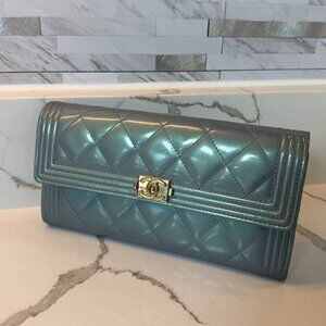 CHANEL Boy Quilted Long Flap Wallet in metallic blue with silver hardware